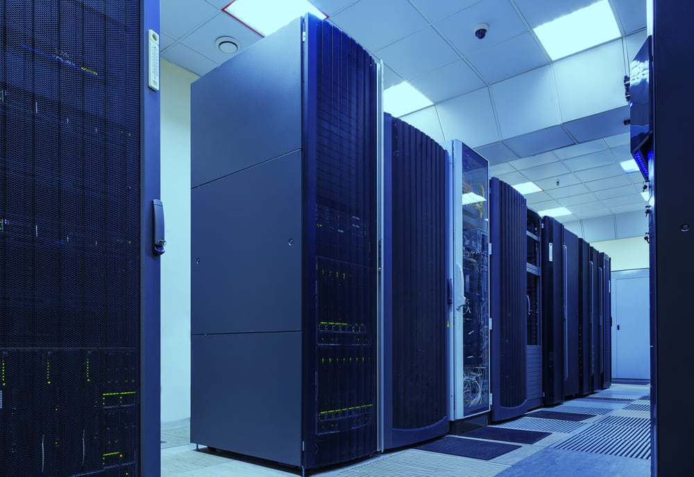 A row of supercomputers, large metallic towers in a clinical room.