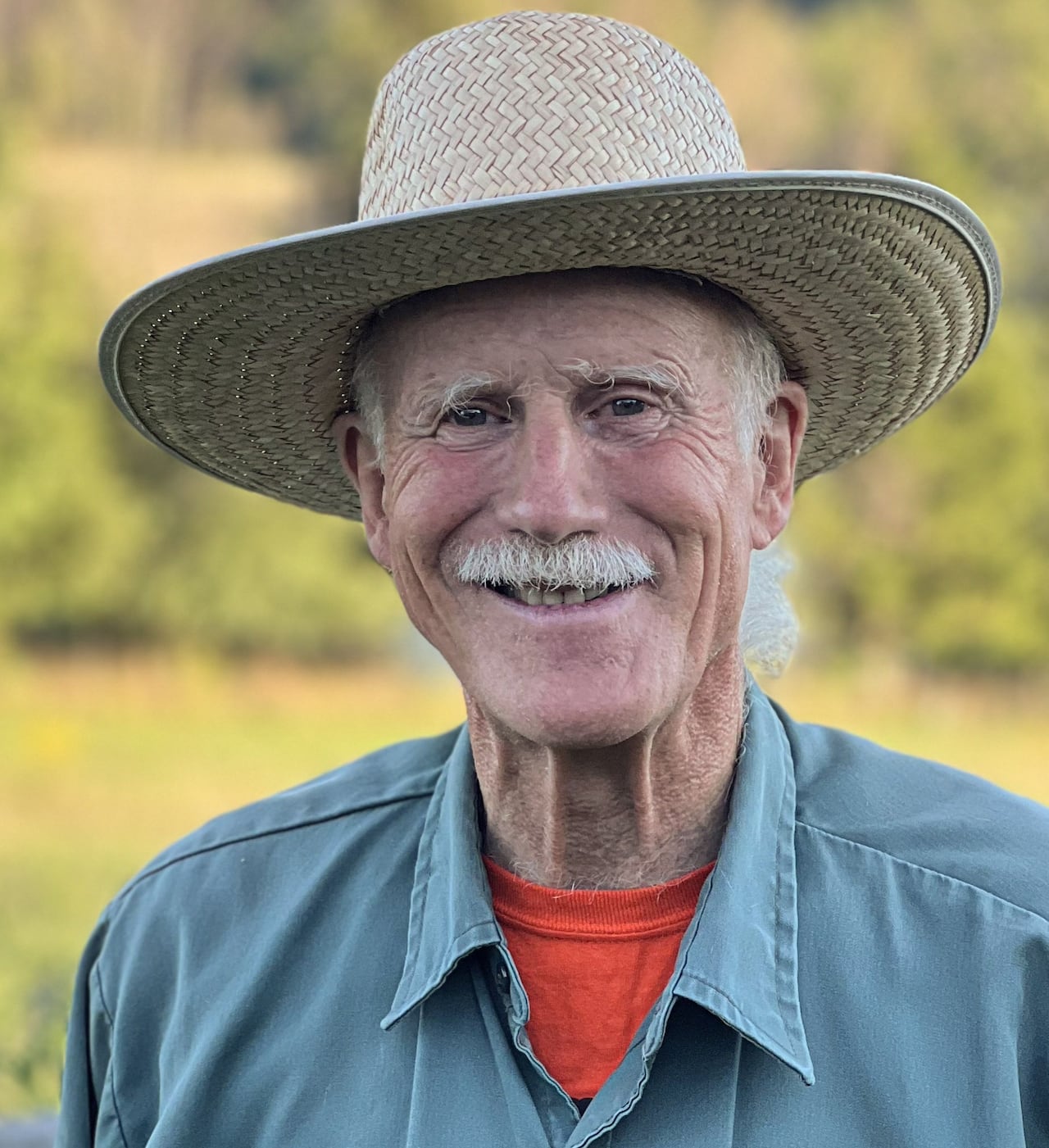 A man in a farmer hat