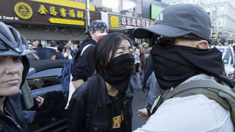 Protests erupt as Ice agents conduct raids in New York City's Chinatown – video