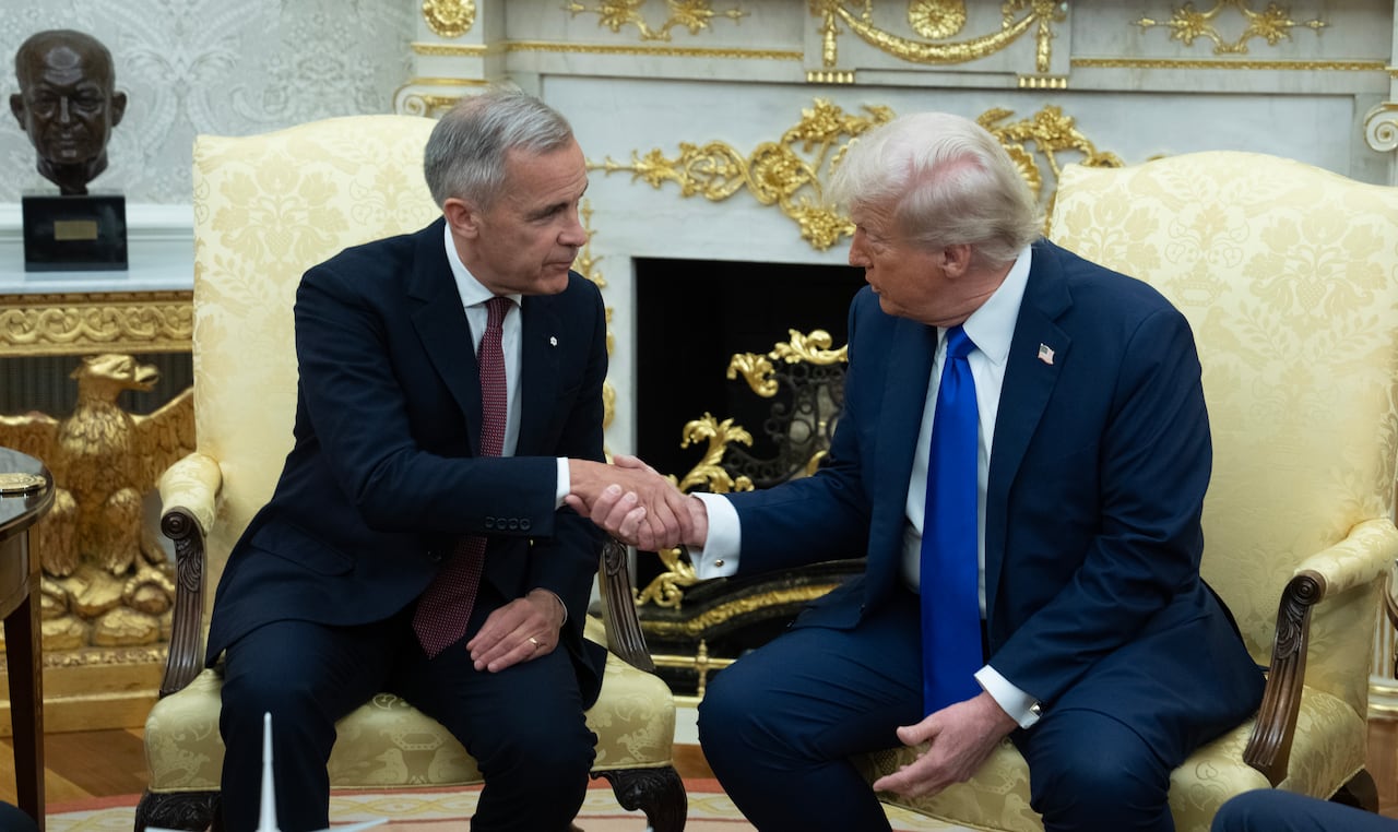 Carney and Trump shake hands.
