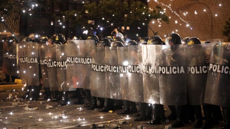 Peru: police and anti-government protesters clash outside congress – video