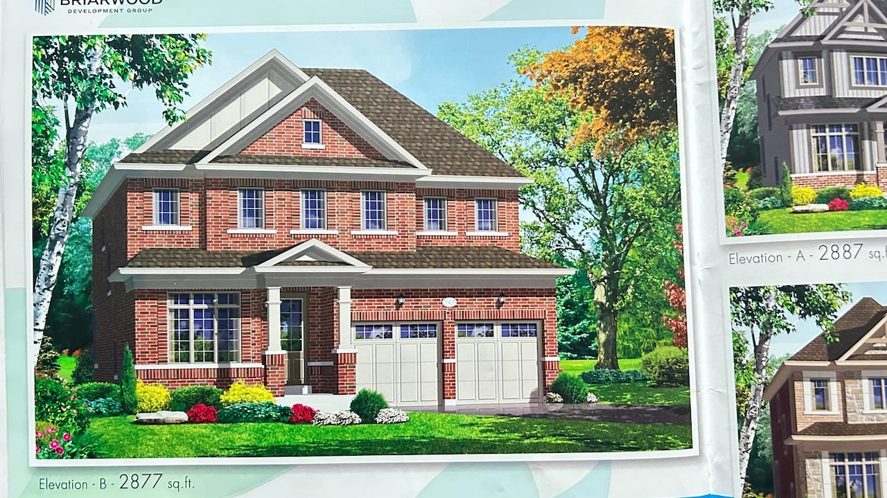 A drawing shows a three-storey, two-car garage brick home.