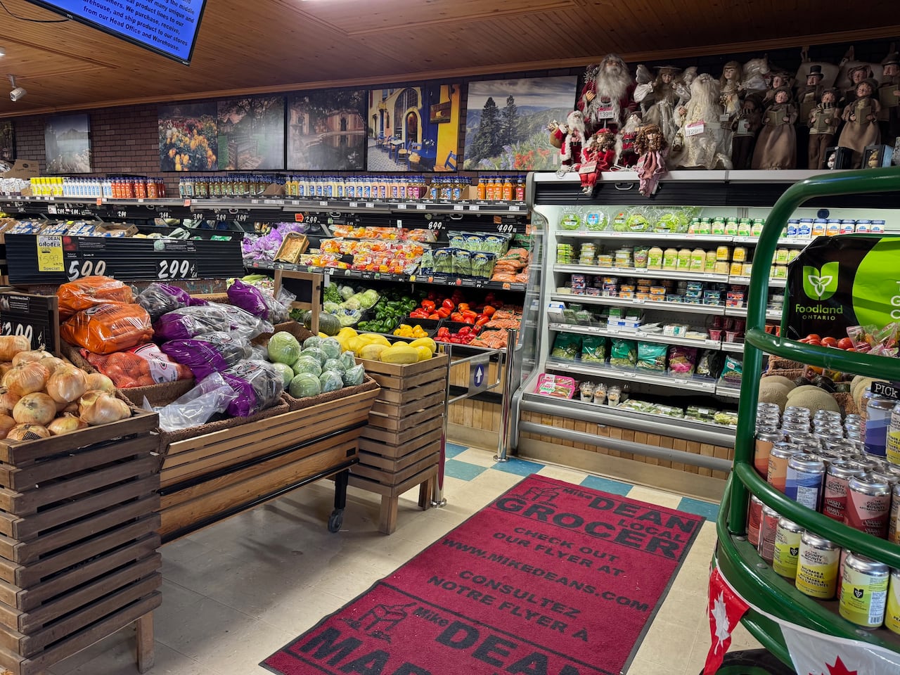 Photo of a gorcery store with a one-way gate installed to control traffic flow.