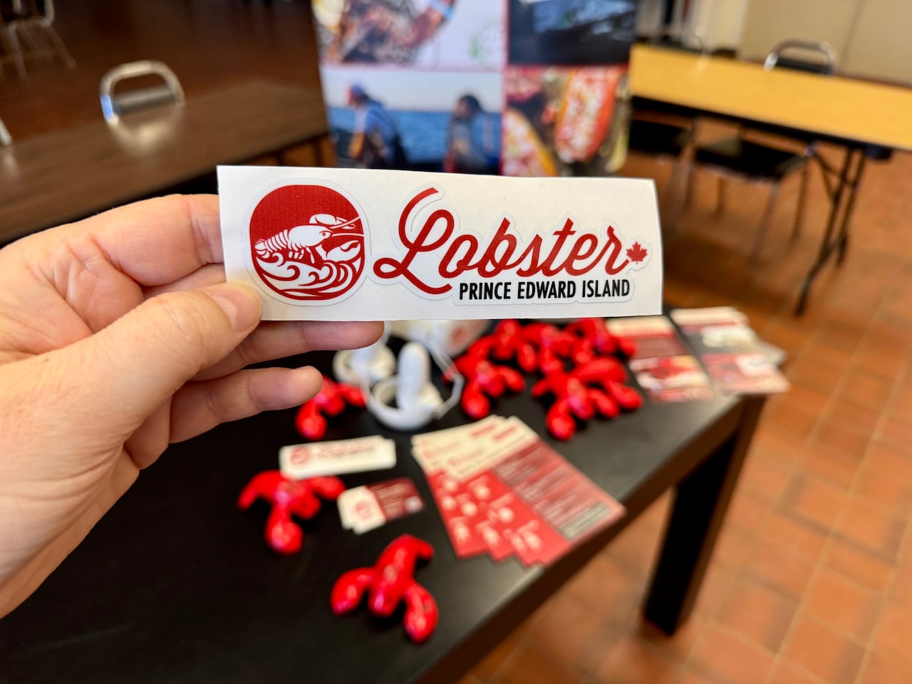 Promotional stickers being handed out by Lobster Prince Edward Island.