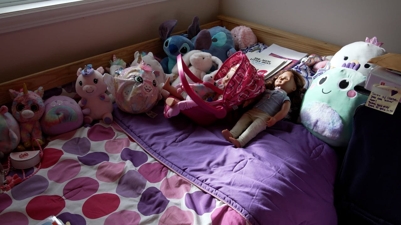 Child's bed with stuffed toys