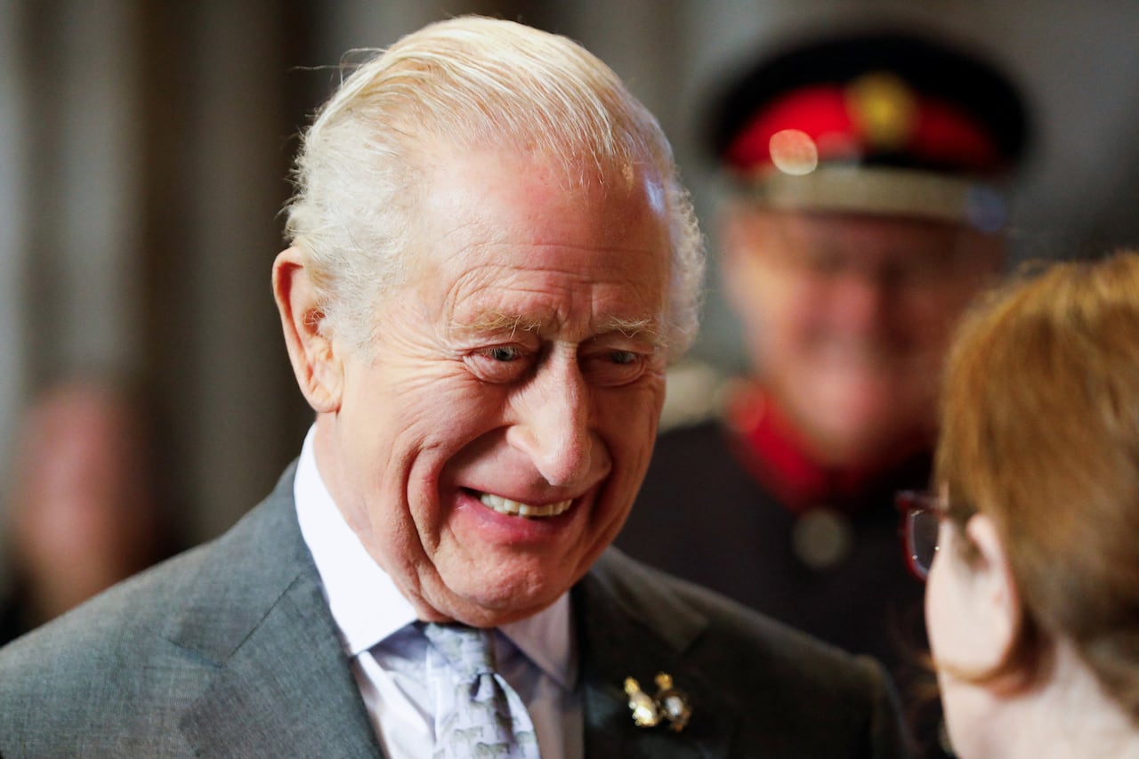 King Charles smiling.