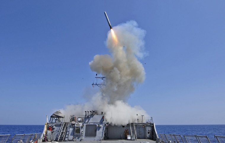 Image: Handout photo of USS Barry launching a Tomahawk cruise missile in the Mediterranean Sea