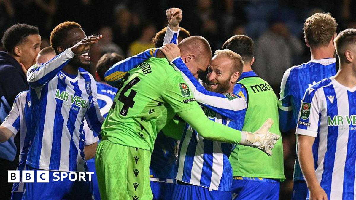 Barry Bannan (centre) hugs goalkeeper Ethan Horvath after they beat Premier League Leeds on penalties in the EFL Cup