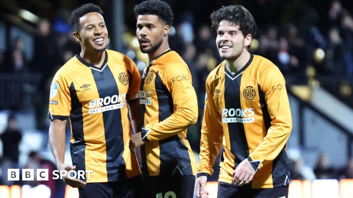 Cambridge United players celebrate during their win against Luton Town