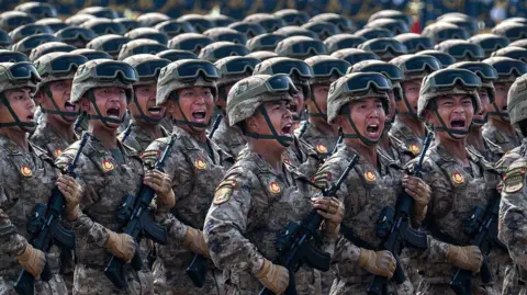 Getty Images Chinese soldiers marching in a parade