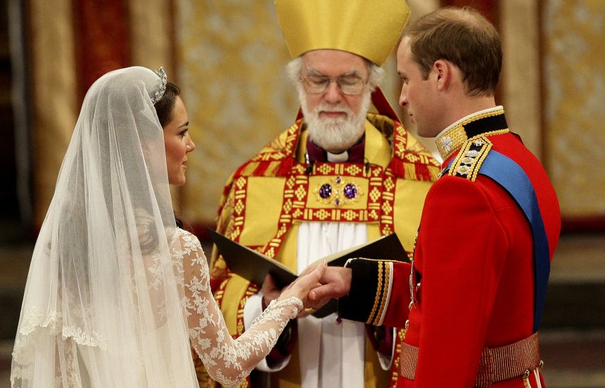 The Prince and Princess of Wales stand before the then-Archbishop of Canterbury, Rowan Williams, during their wedding ceremony in Westminster Abbey in 2011.