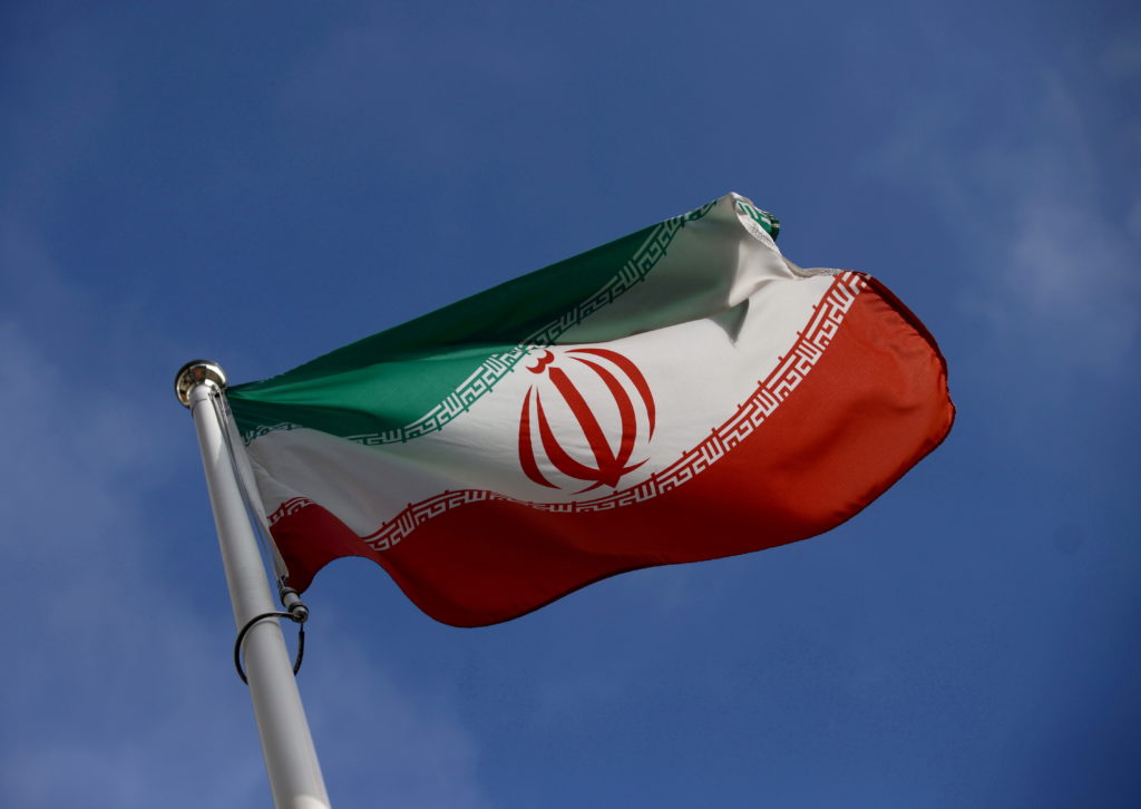 The Iranian flag waves in front of the International Atomic Energy Agency (IAEA) headquarters, before the beginning of a b...