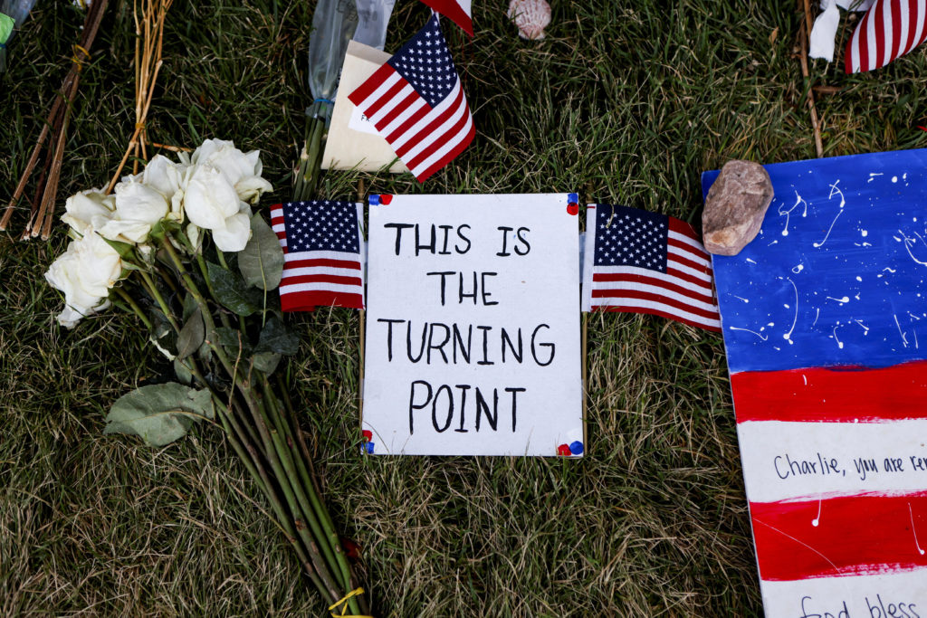 People pay their respects at a memorial for slain conservative commentator Charlie Kirk, at Utah Valley University