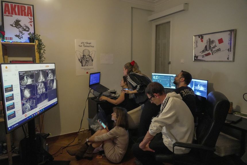 Greek pro-Palestinian activists monitor the Global Sumud Flotilla in Athens on Wednesday.