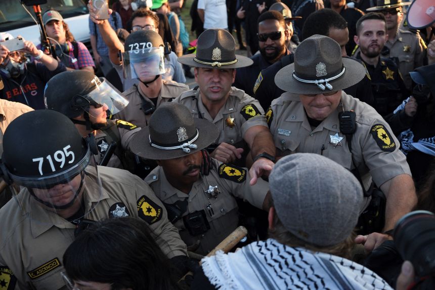 People protest outside the U.S. Immigration and Customs Enforcement (ICE) Broadview facility in Chicago, Illinois, U.S., October 3, 2025.