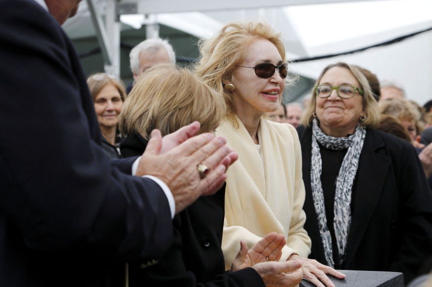 Joan Kennedy, first wife of late former Sen. Ted Kennedy, gets a standing ovation as she is recognized at the dedication ceremony for the Edward M. Kennedy Institute for the United States Senate, in Boston, on March 30, 2015.