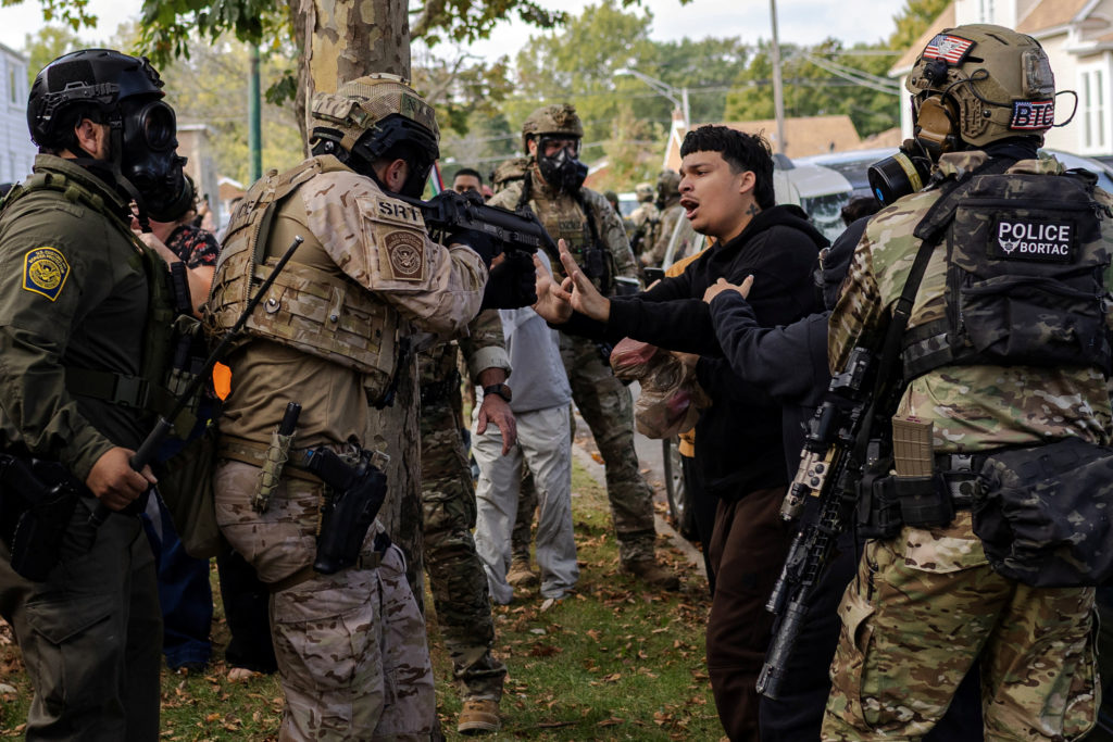 Police clash with community members after detaining a man on Chicago's South Side