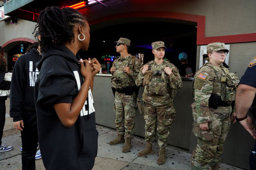 US Army National Guard members patrol in the entertainment district, Beale Street, in downtown Memphis, Tennessee, on Thursday.