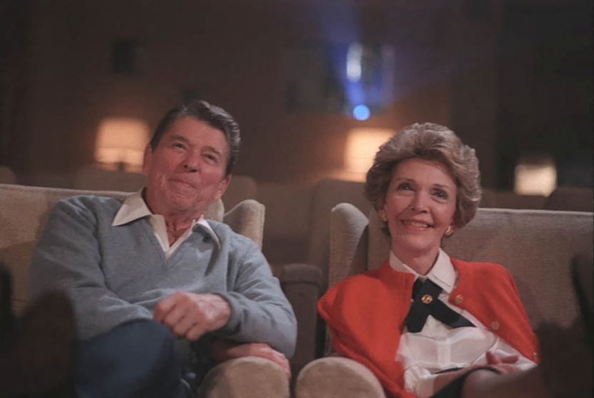 Ronald and Nancy Reagan sit in the East Wing family theatre at the White House in Washington, D.C., in 1986.