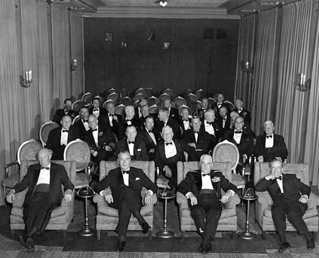 President Dwight Eisenhower and guests sit in the East Wing family theater in 1958.
