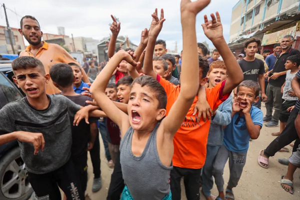 Palestinian children celebrate in Khan Younis on October 9, 2025, following news of a new Gaza ceasefire deal.
