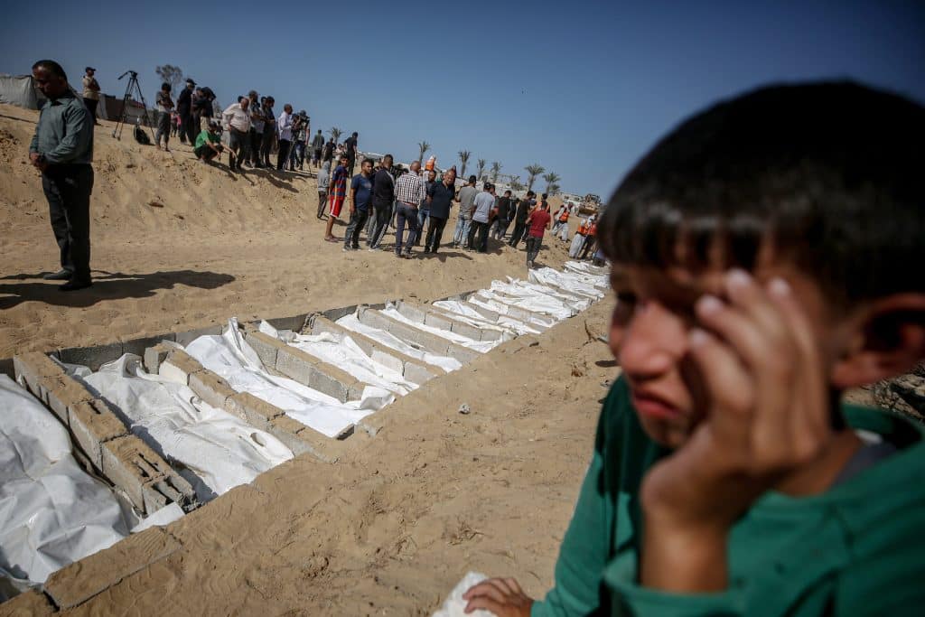 The Gaza Government Media Office said the mutilated bodies of Palestinian prisoners were received by the Ministry of Health with hands and feet bound with zip ties, some with blindfolds over their eyes, and others bearing the marks of tank tracks, burns, fractures, and deep wounds, October 22, 2025. (Photo: Omar Ashtawy/APA Images)