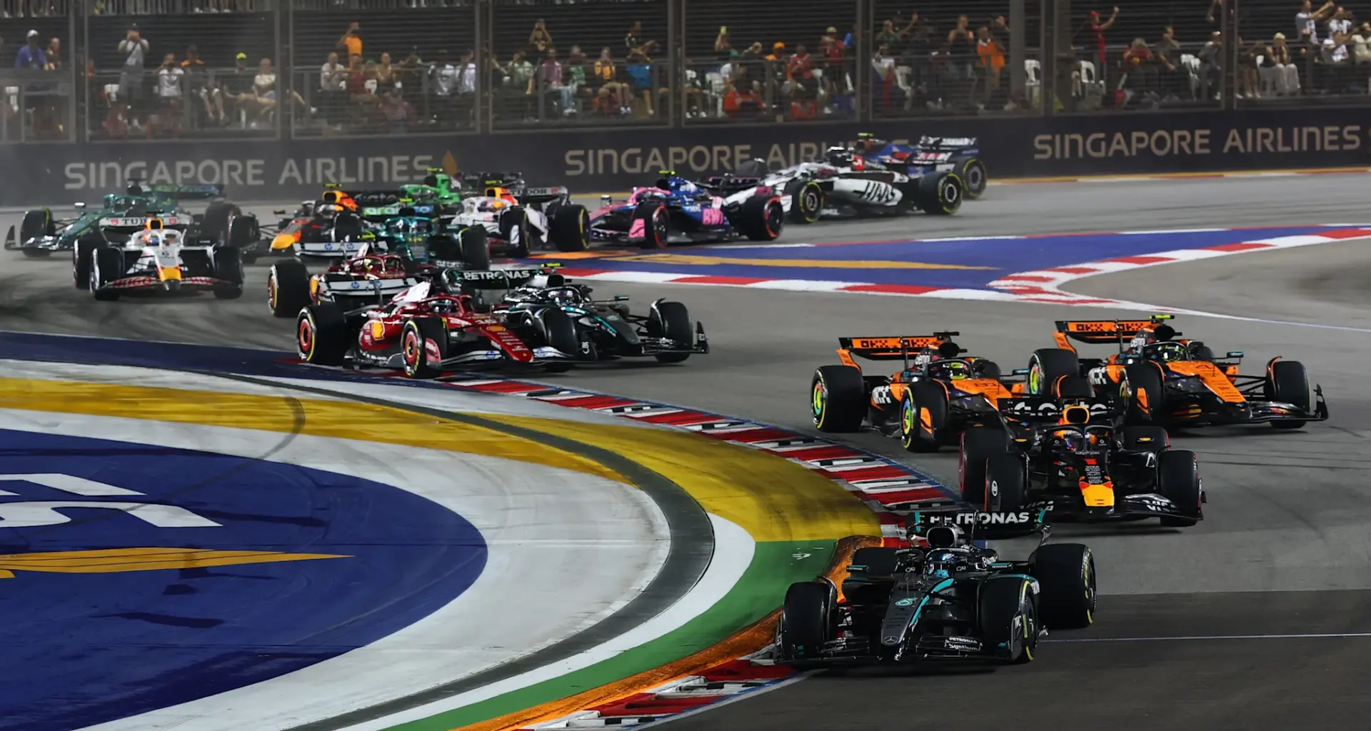 SINGAPORE, SINGAPORE - OCTOBER 05: Race winner George Russell of Great Britain and Mercedes AMG