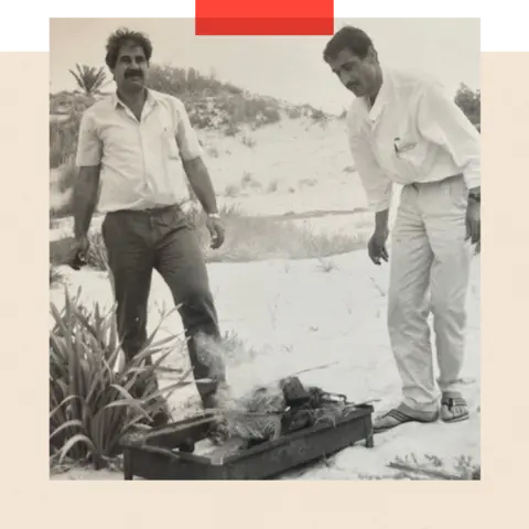 Ahmed Younis family archive Ayish and a colleague at a beach barbecue - black and white image