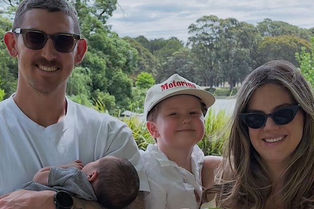 Nic Maddinson holding new son Wilder, alongside August and wife Bianca.