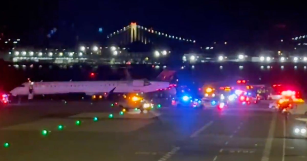 Plane taxiing at LaGuardia Airport is clipped by another jet on the ground