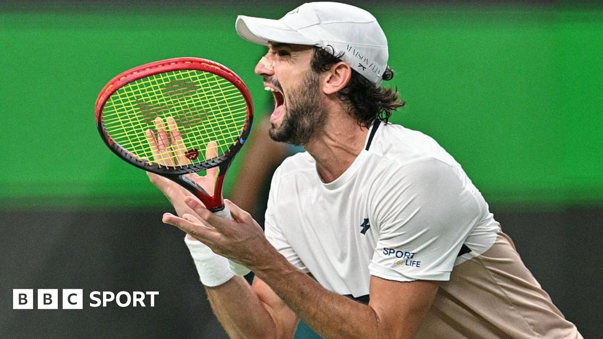 Harry Kane claps while playing for England