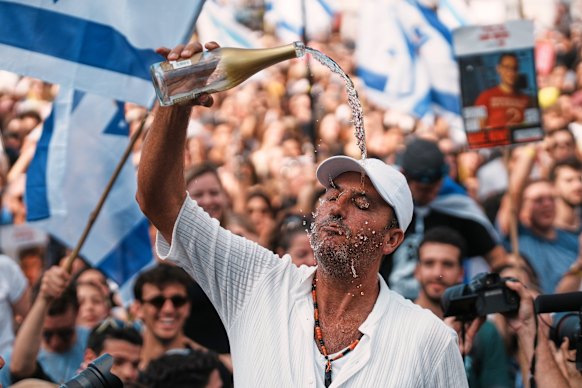 People celebrate in hostages square.