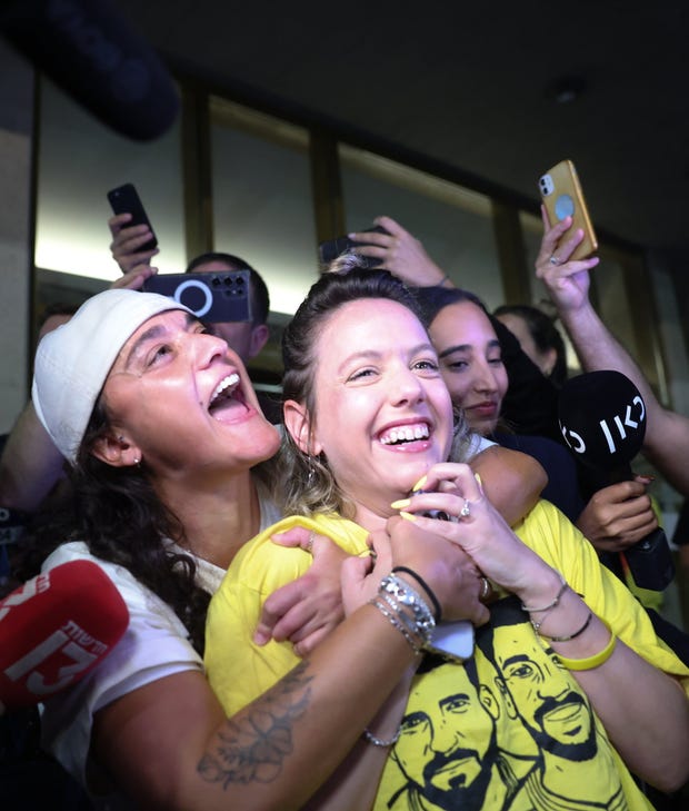 Released Israeli hostage Emily Damari, left, celebrating the announcement of a cease-fire and hostage deal, at Hostage Square in Tel Aviv.