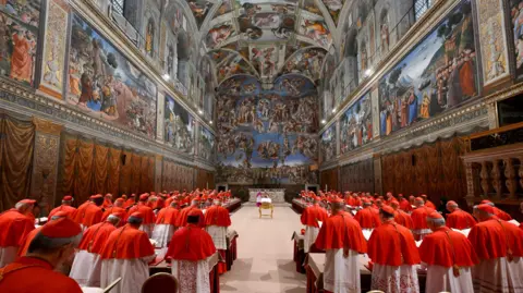 Reuters Cardinals gathered in the Sistine Chapel in the Vatican