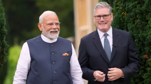 PA Media Prime Minister Sir Keir Starmer (right) with the Prime Minister of India, Narendra Modi, walk in the grounds during his visit to Chequers, the country house of the serving Prime Minister of the UK, near Aylesbury in Buckinghamshire. Picture date: Thursday July 24, 2025. PA Photo.