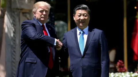Reuters U.S. President Donald Trump (L) and China's President Xi Jinping shake hands while walking at Mar-a-Lago estate after a bilateral meeting in Palm Beach, Florida, U.S. in 2017.