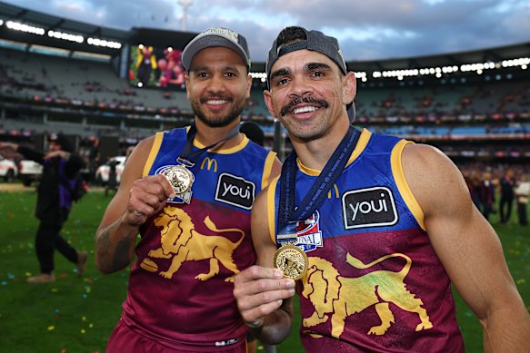 Callum Ah Chee with friend and teammate Charlie Cameron after their grand final win.