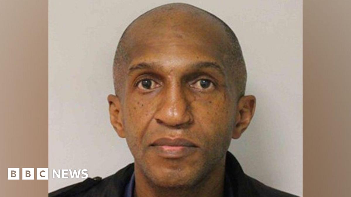 Anthony Marks wearing a dark shirt and jacket, looking directly into the camera