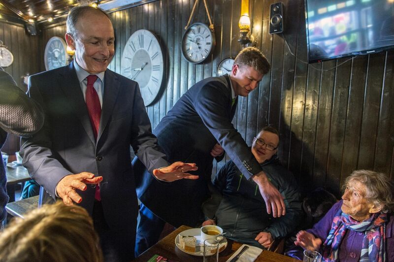Mr Martin canvassing in McCarthy's Bar in Youghal in 2020 with then candidate James O’Connor. Picture: Michael Mac Sweeney/Provision
