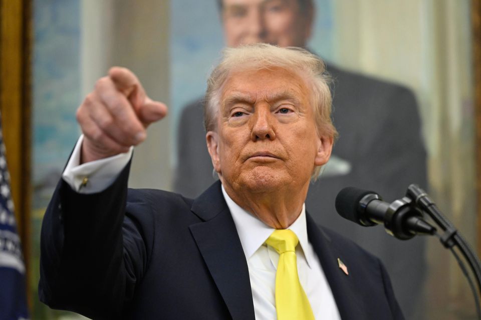 President Donald Trump in the Oval Office at the White House (John McDonnell/AP)