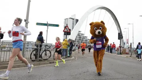 Great Scottish Run A person running dresses as a bear