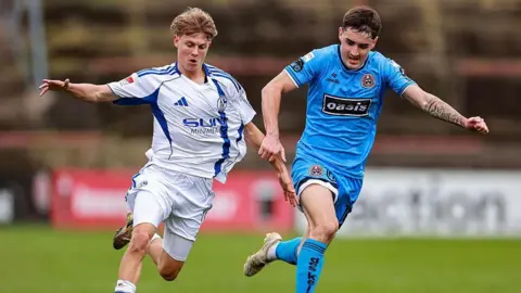 Getty Images Luca Vozar of Schalke 04 in action against Dawson Devoy of Bohemians during the mid-season friendly match between Bohemians and Schalke 04 at Dalymount Park in Dublin