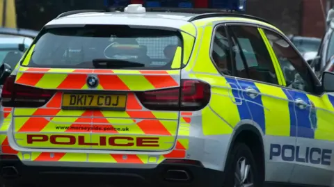 PA Media Merseyside Police car in full livery on a street