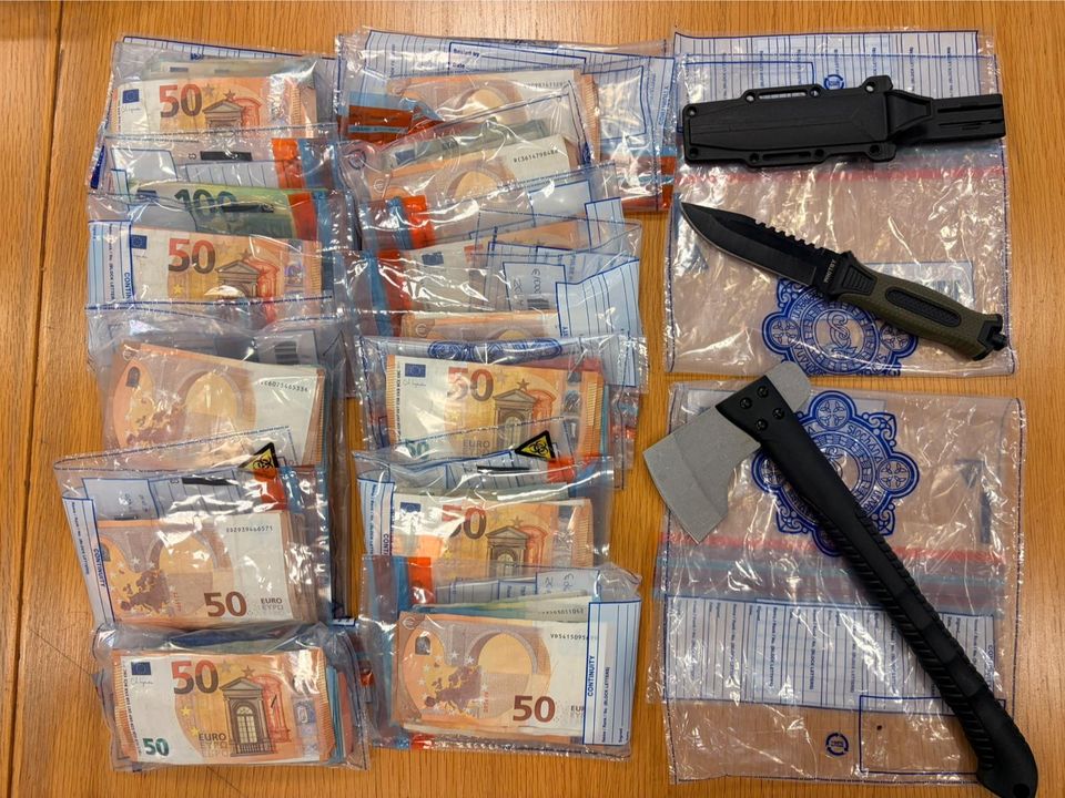 Cash and weapons were seized