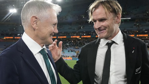 New Zealand coach Scott Robertson chats with Australia coach Joe Schmidt.