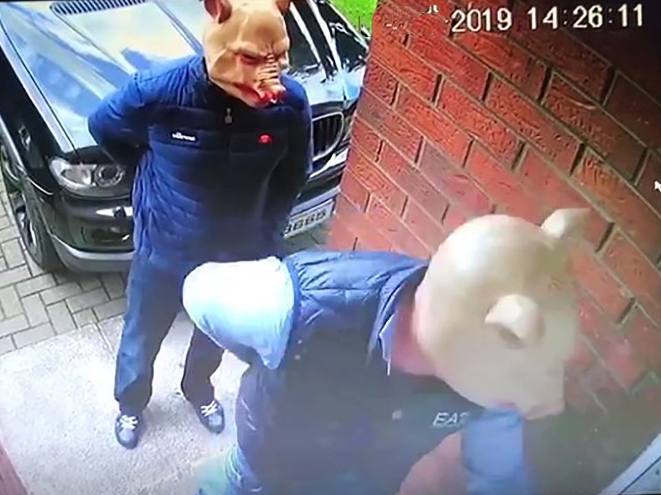 .Gunmen wearing pig masks at McKeown's door