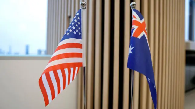 US and Australian flags