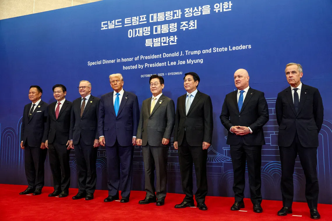 U.S. President Donald Trump, Canadian Prime Minister Mark Carney, Australian Prime Minister Anthony Albanese, South Korean President Lee Jae Myung, Singapore's Prime Minister Lawrence Wong, Thailand Prime Minister Anutin Charnvirakul, Vietnam's President Luong Cuong and New Zealand's Prime Minister Christopher Luxon pose for a family photo, on the day of an Asia-Pacific Economic Cooperation (APEC) leaders' dinner hosted by South Korean President Lee Jae Myung in Gyeongju, South Korea, October 29, 2025. REUTERS/Evelyn Hockstein