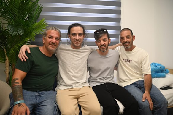 Ariel and David Cunio with their family at the initial reception point after their release.