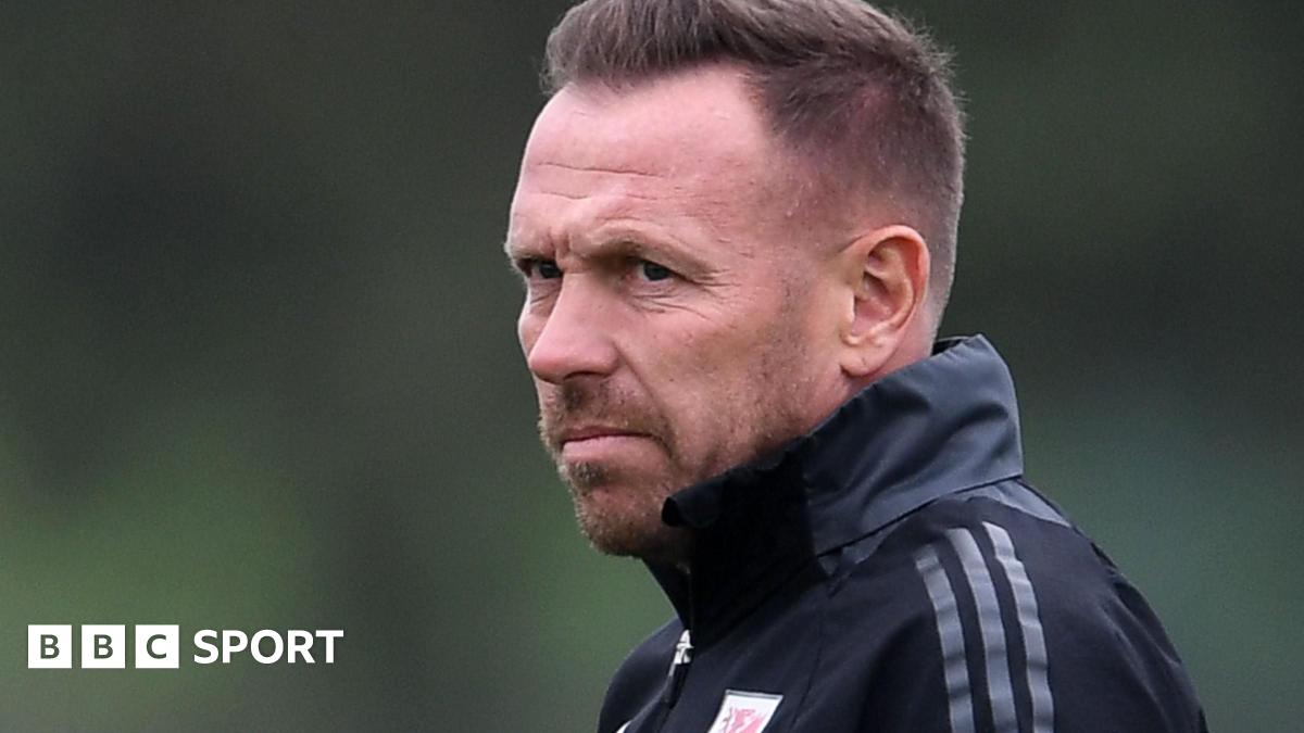 Harry Kane claps while playing for England